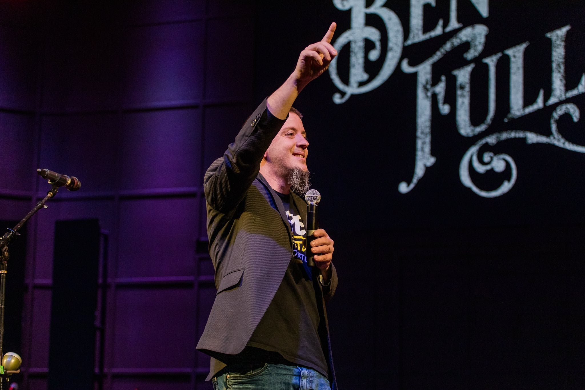 Justin Franich speaking on stage